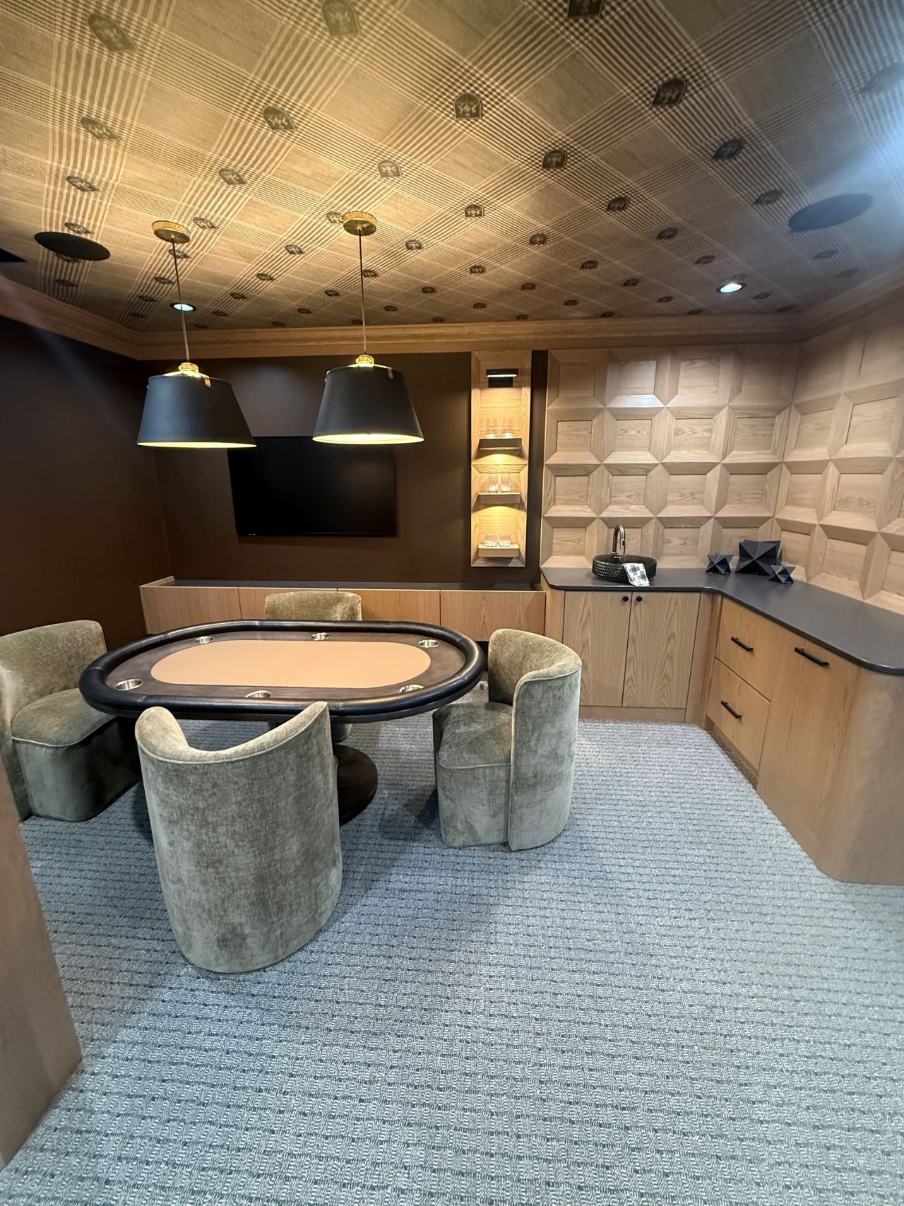 Finished media room with in-ceiling speakers and zoned lighting wired by MG Electric